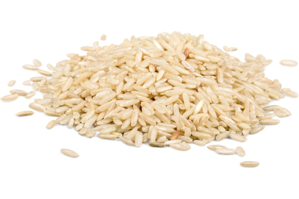 grain of brown rice situated on a white background
