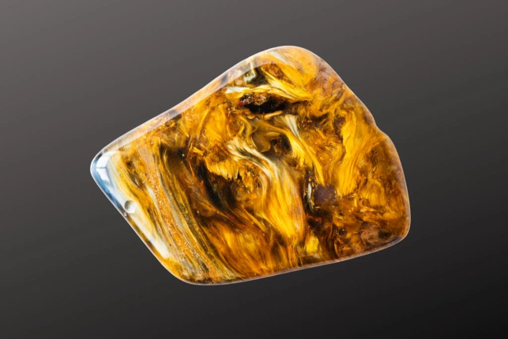 a pietersite crystal on a dark background