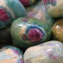 Eudialyte vs. Ruby in Fuchsite