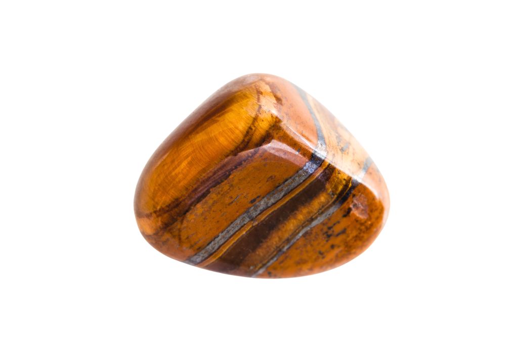 Tiger's eye crystal on a white background