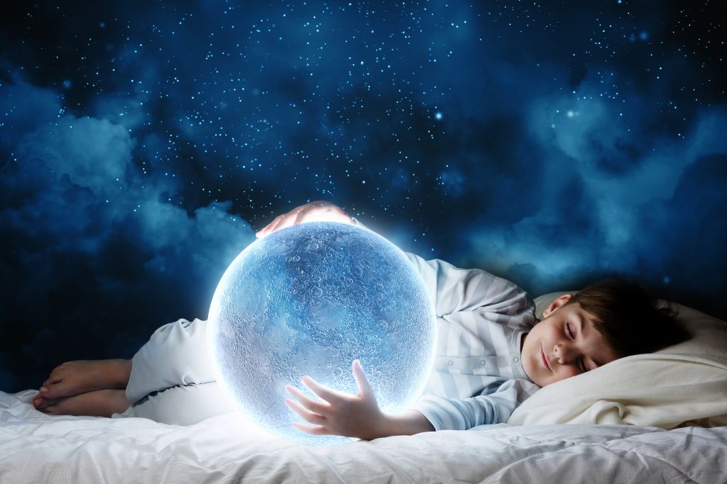 A child is sleeping on the bed