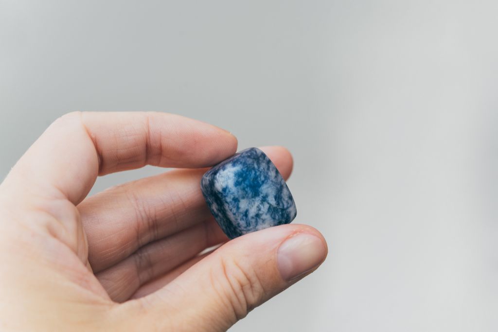 A person holding a Blue Quartz (Aka Trolleite)