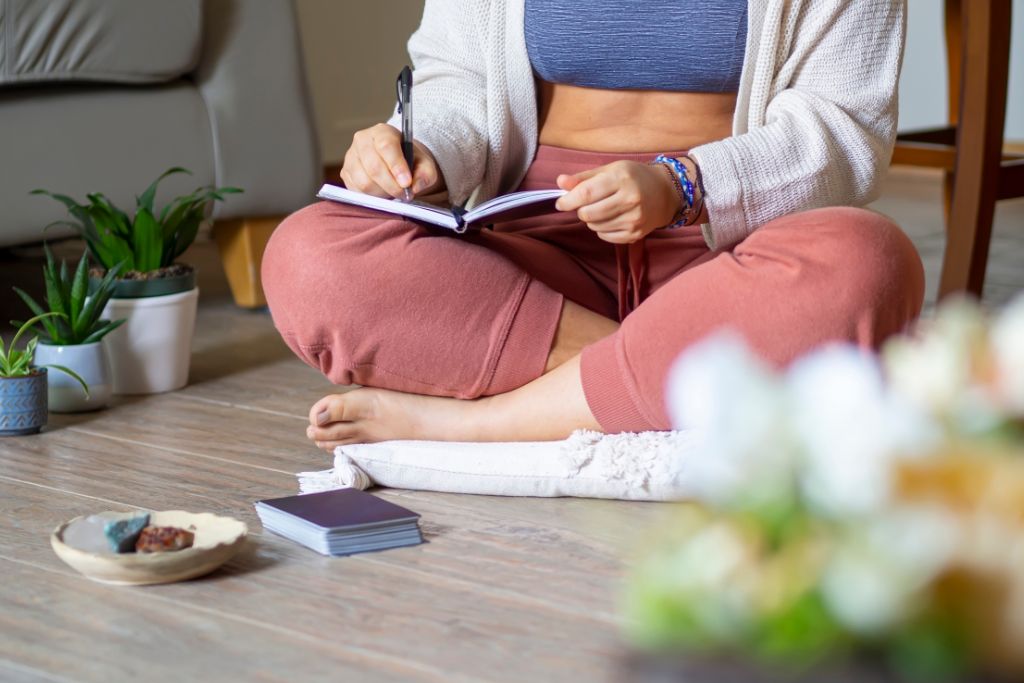 Manifestation and woman writing a book