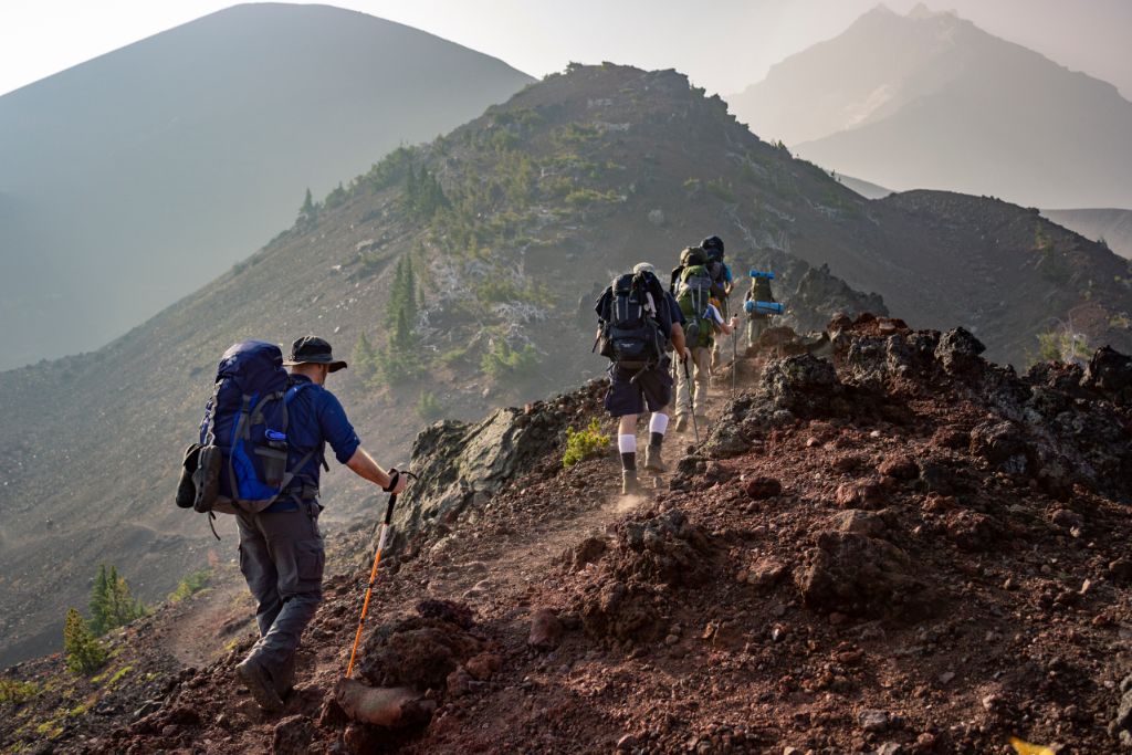 A group of people climbing mountains