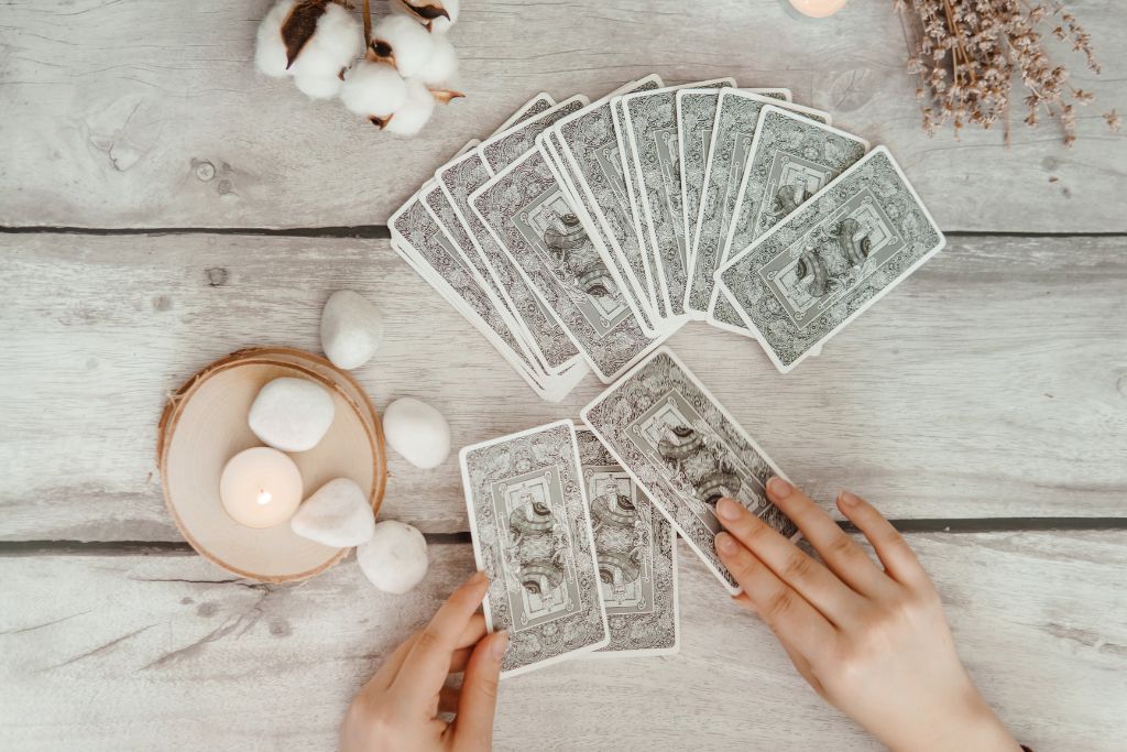 Tarot crystal and a hand