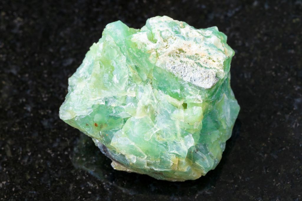 chrysopal chunk on granite background