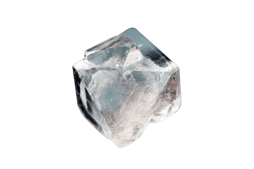 Irregular cubic shaped Diamond on a white background