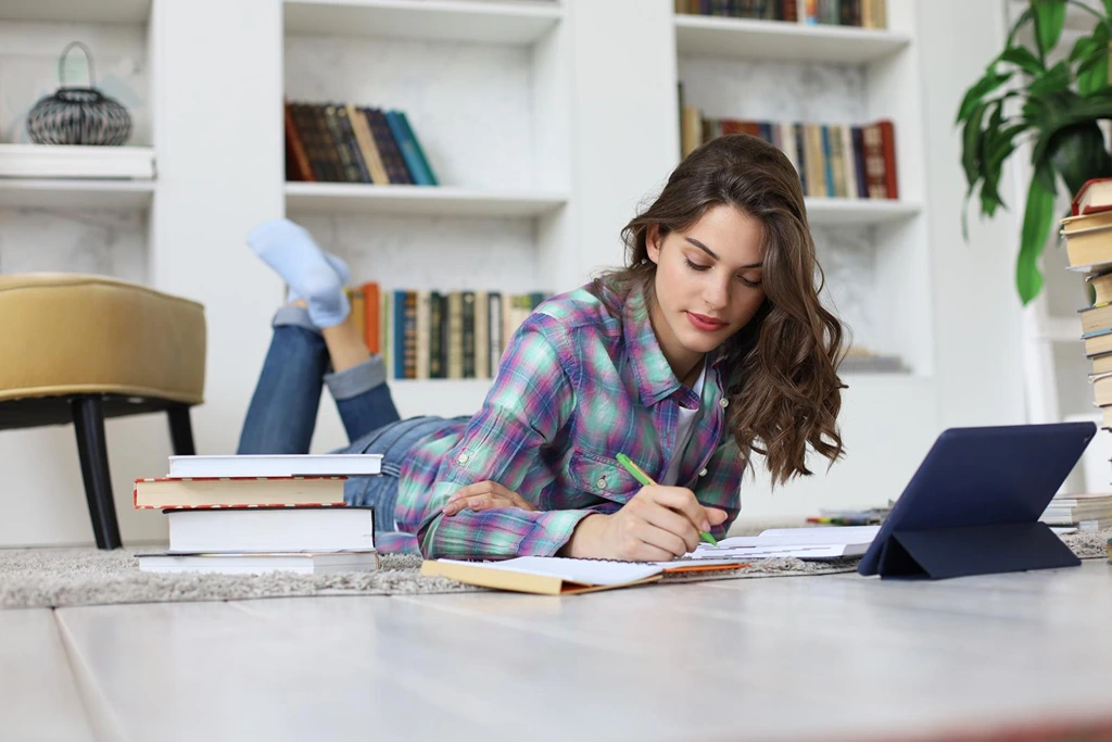 woman studying on floor