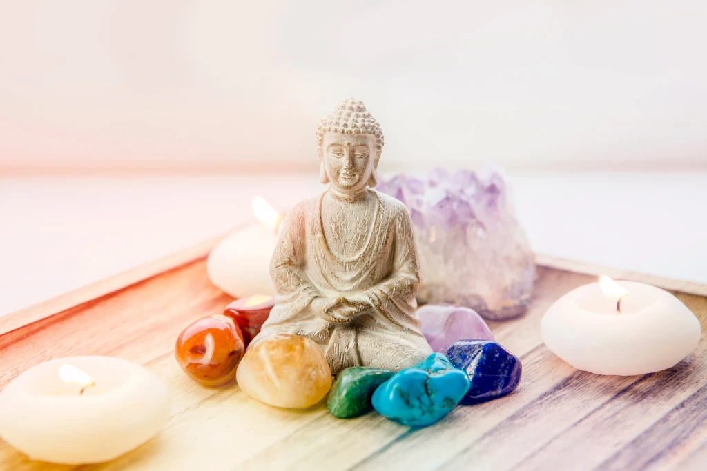 chakra crystals surrounding a buddha statue