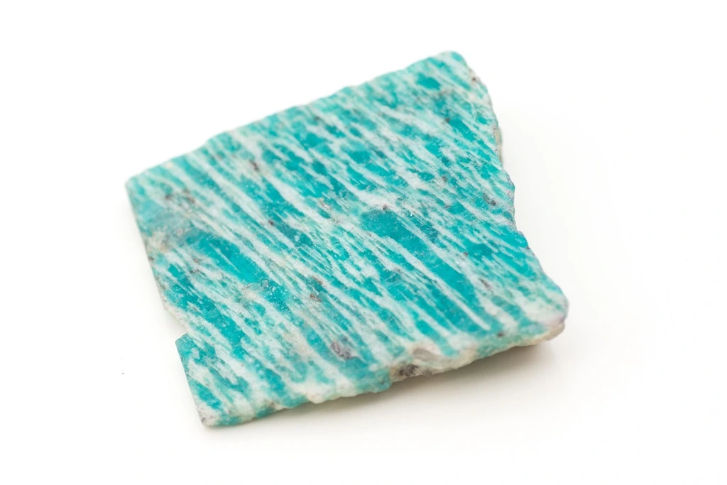 chunk of amazonite on a white background