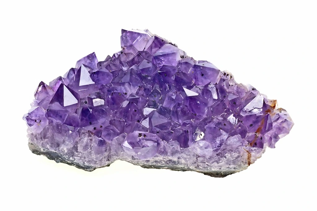 chunk of amethyst crystal on a white background