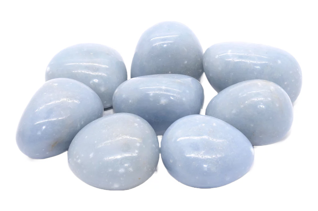 polished angelite stones on a white background