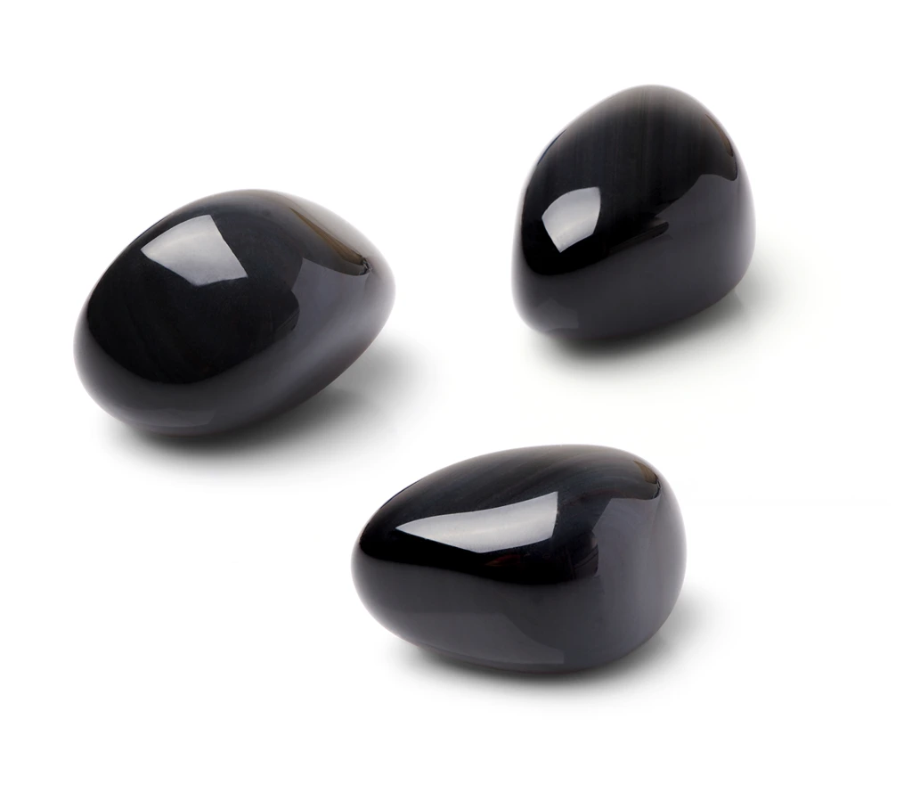 Polished black obsidian on a white background