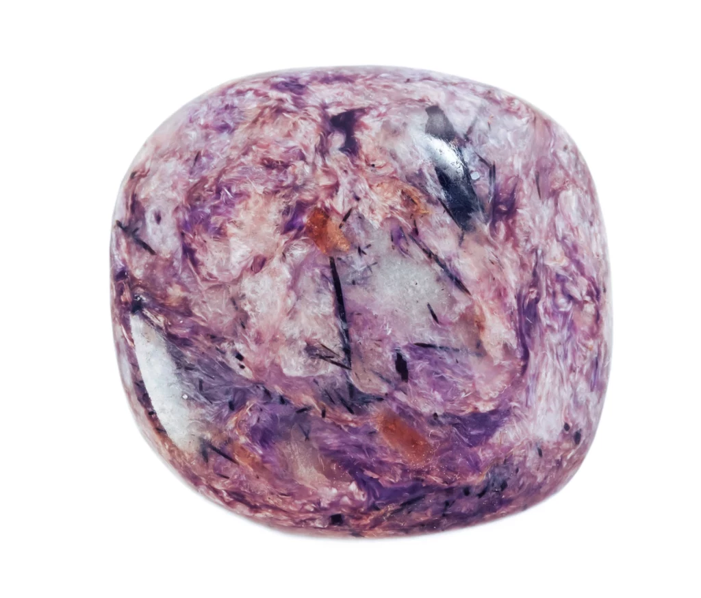 Polished Charoite stone on a white background