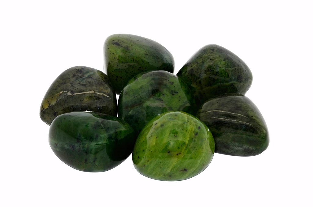 Polished Jade stones on a white background