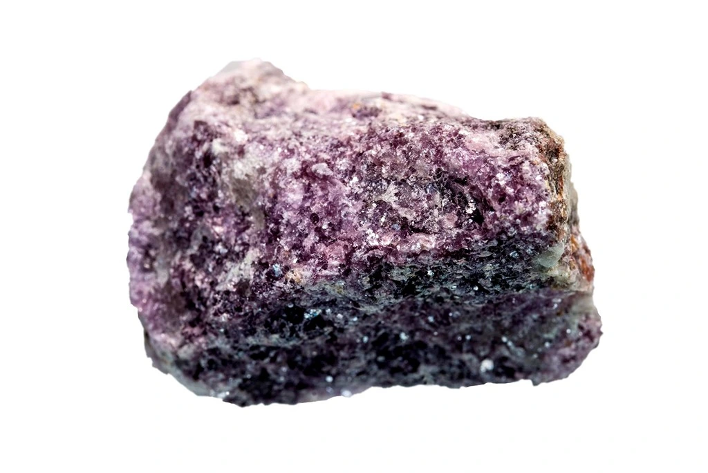 Lepidolite chunk on a white background