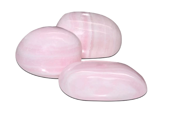 3 pieces of pink mangano calcite on a white background