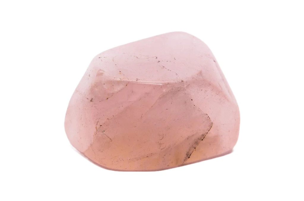 polished rose quartz stone on a white background