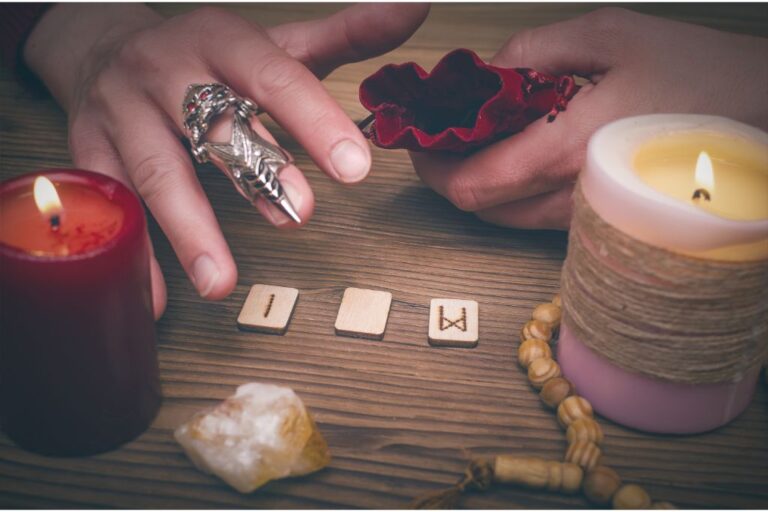 divination ritual with runes, crystals and candles