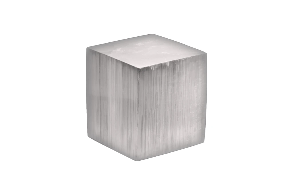 Grayish selenite cube on a white background