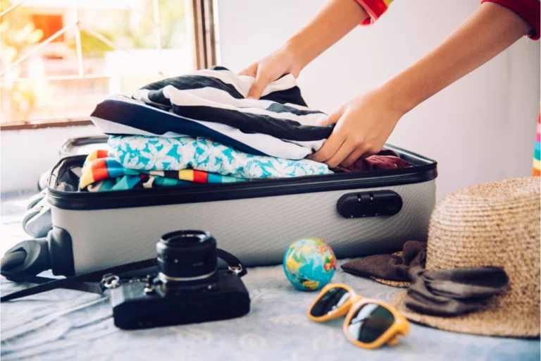 woman packing a luggage for travel