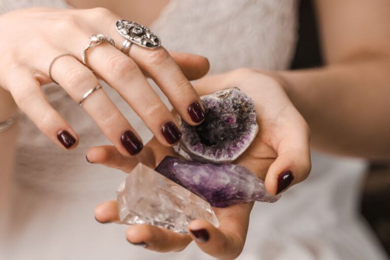 woman holding assorted crystals