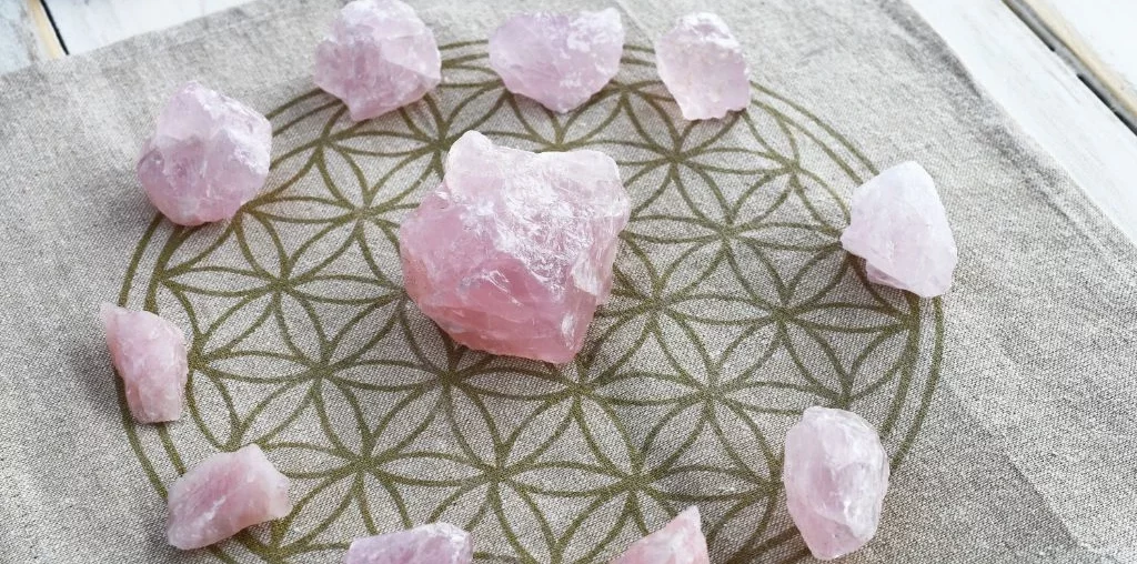 rose quartz crystals on a printed cloth