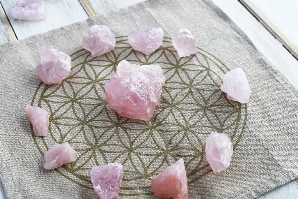 rose quartz crystals on a printed cloth
