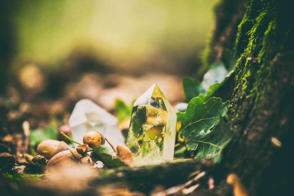 crystal on a bed of leaves