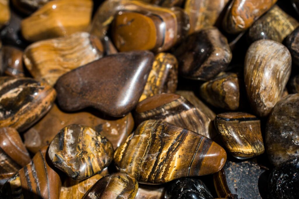 a bunch of tigers eye stones placed next to each other