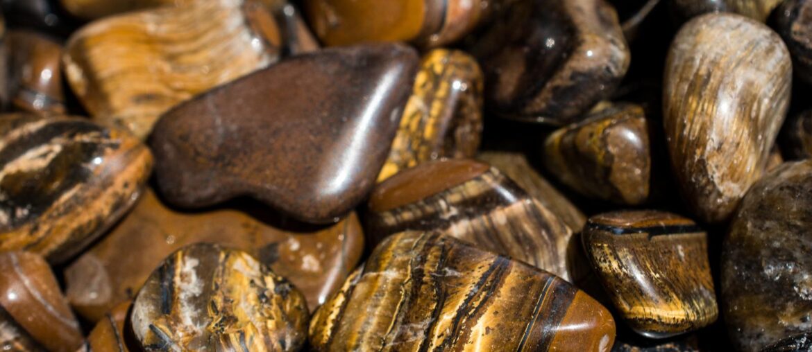 a bunch of tigers eye stones placed next to each other