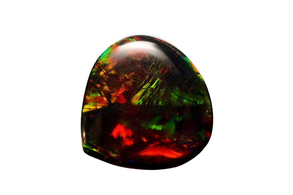 Polished Black Opal on a white background