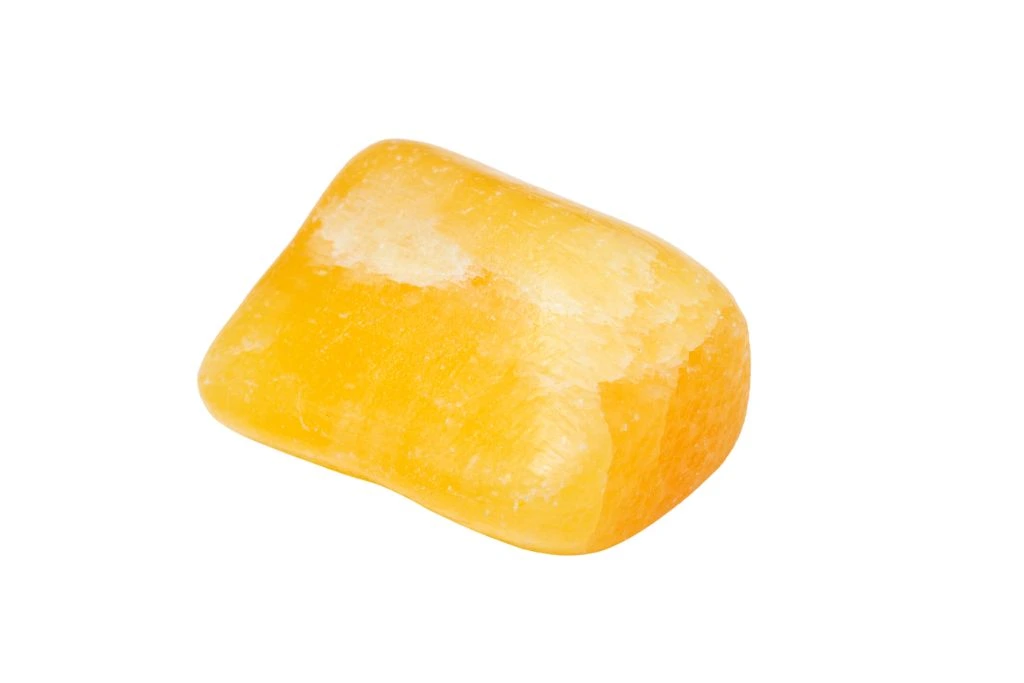 honey calcite on a white background