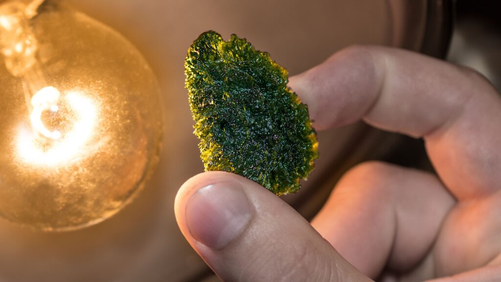 modavite stone held by fingers