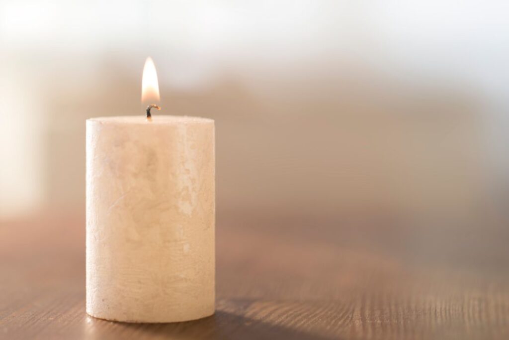white candle on a blurred background