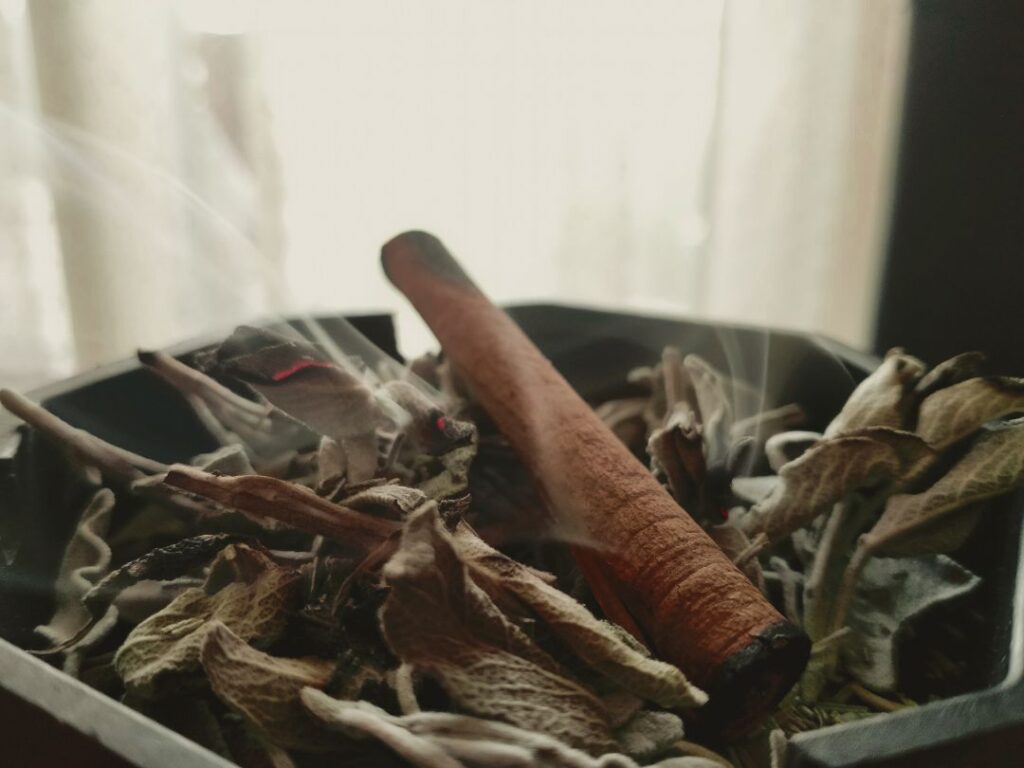 incense on top of lit herbs