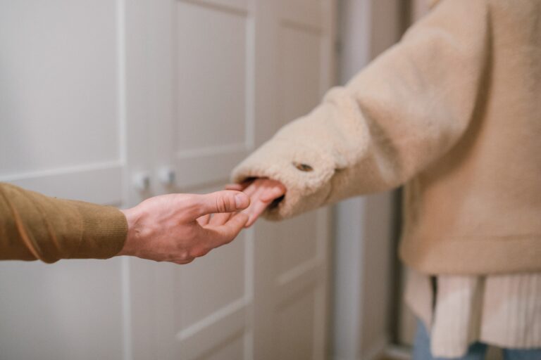 couple letting go of each others hands