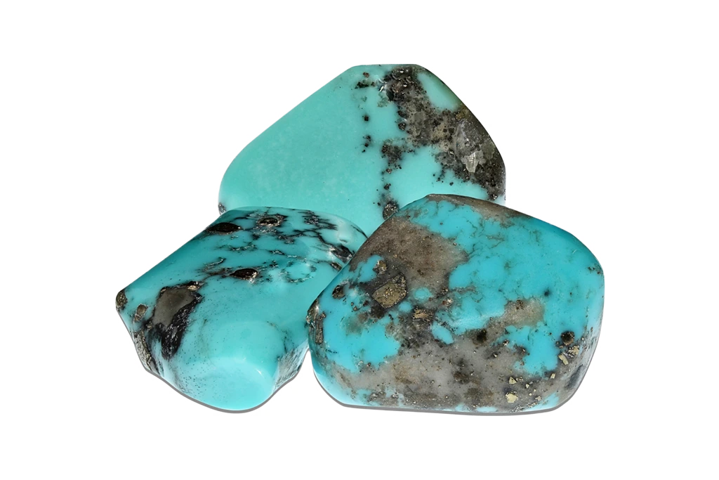 3 polished turquoise stone on white background
