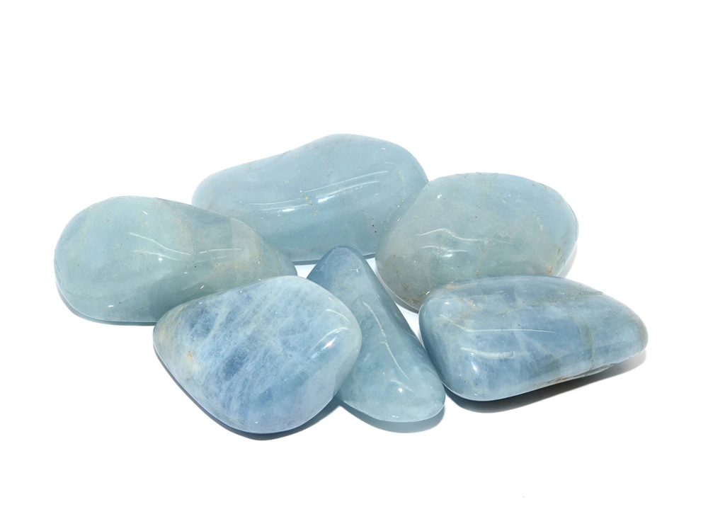 six pieces of aquamarine on a white background