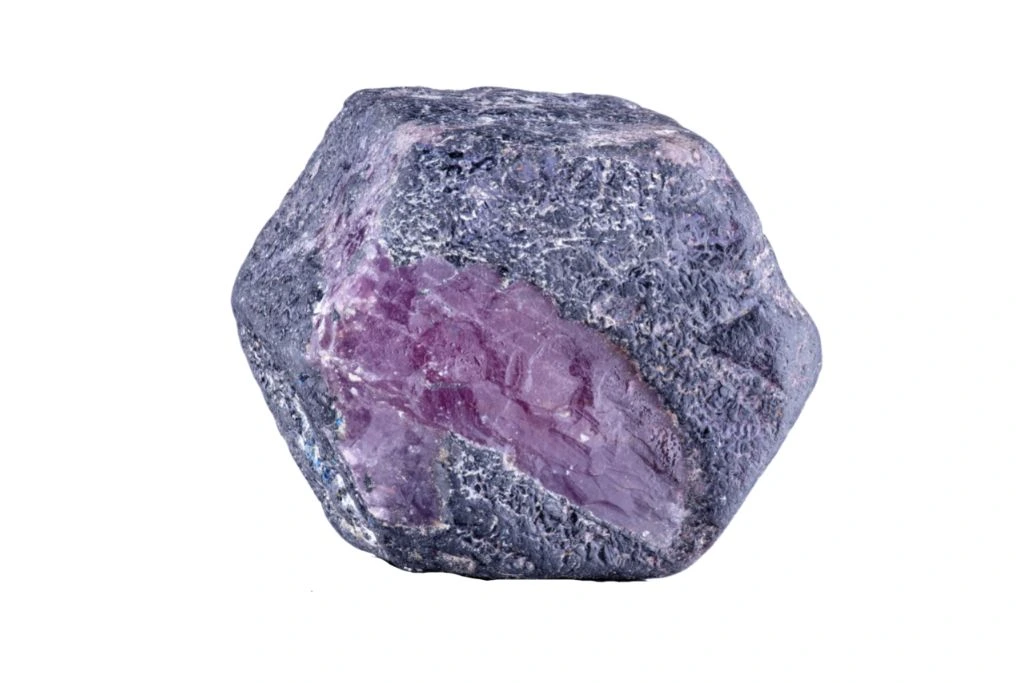 A Corundum crystal on a white background