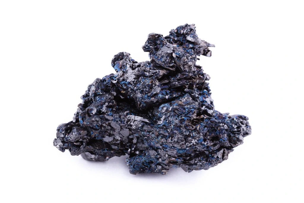 a chunk of covellite for dream work on a white background