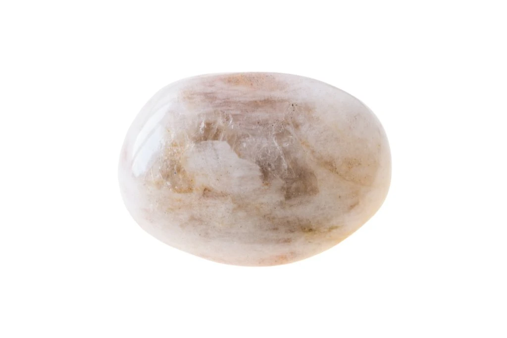 polished cream moonstone on a white background