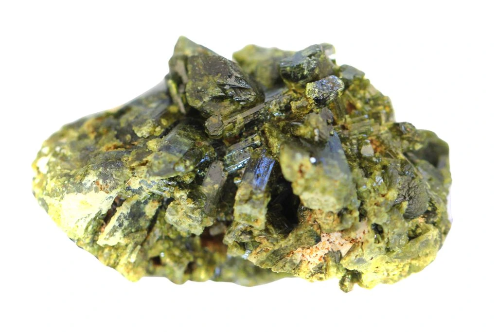 a chunk of epidote crystal for dream protections on a white background