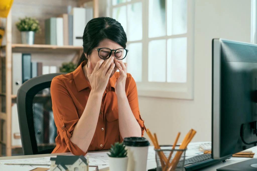 Frustrated woman at her desk