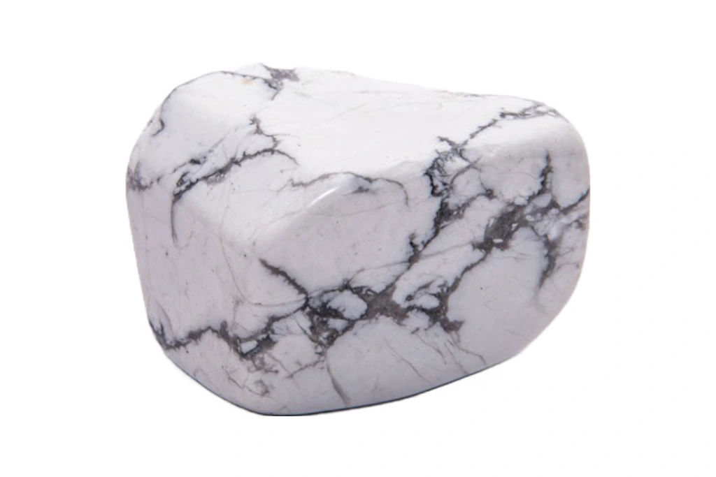 a piece of howlite stone for sweet dreams on a white background