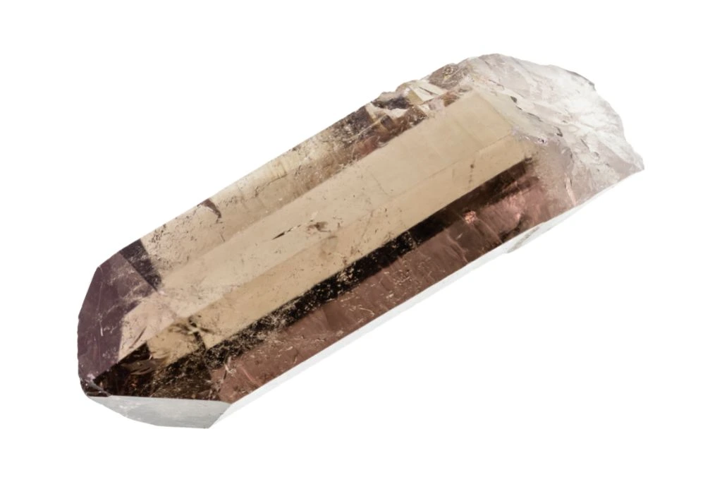 a piece of lithium quartz for interpreting dreams on a white background