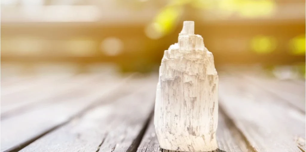 selenite tower on a wooden background