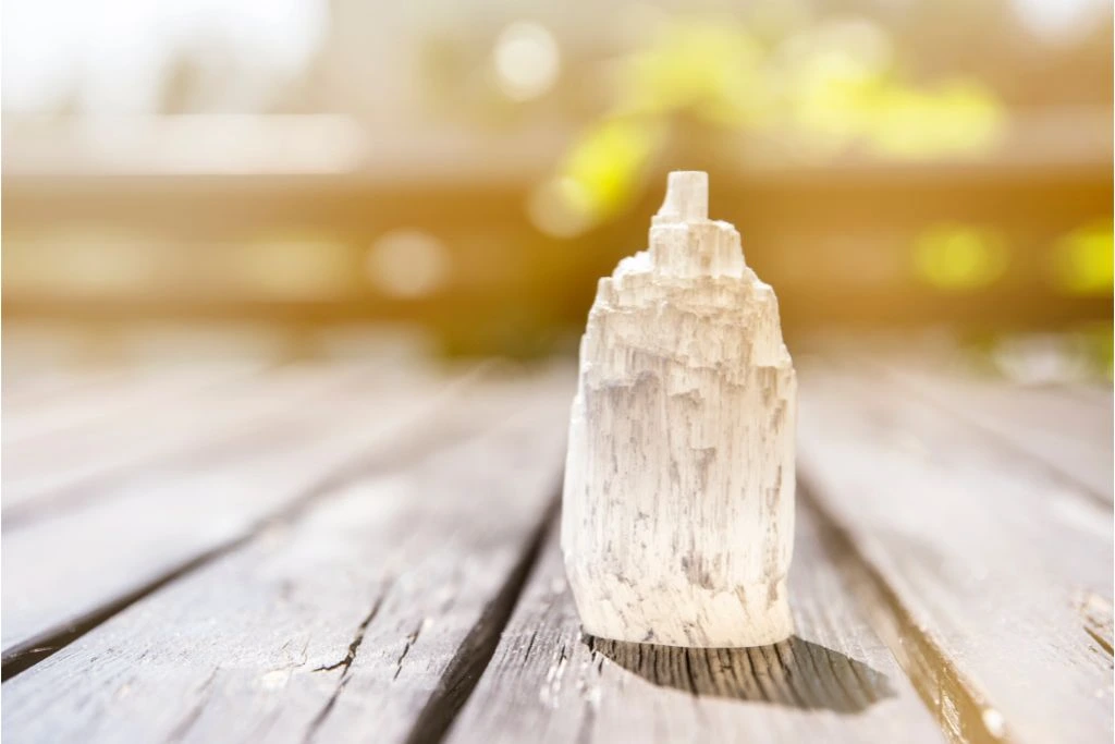 selenite tower on a wooden background