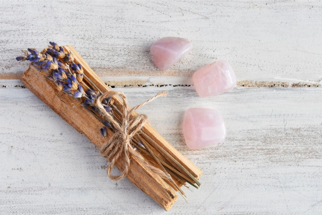3 pieces of rose quartz together with sage wood