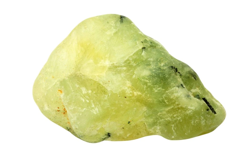large piece of prehnite crystal for remembering dreams on a white background